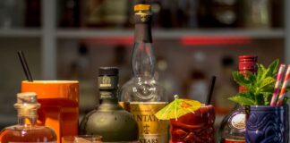 Bottles of liquor and cocktails on a great Mexico City cocktail bar.