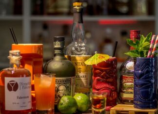 Bottles of liquor and cocktails on a great Mexico City cocktail bar.