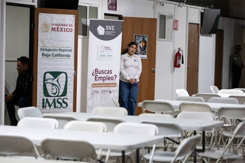 A sign reading "are you looking for a job" at a refuge for deportees in Tijuana