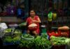 Woman vendor sells groceries at a market