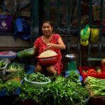 Woman vendor sells groceries at a market