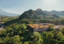 Aerial view of Hacienda de San Antonio with mountain backdrop including the Colima Volcano