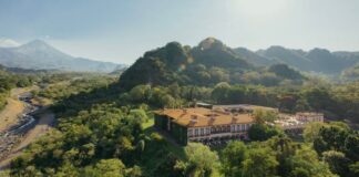 Aerial view of Hacienda de San Antonio with mountain backdrop including the Colima Volcano