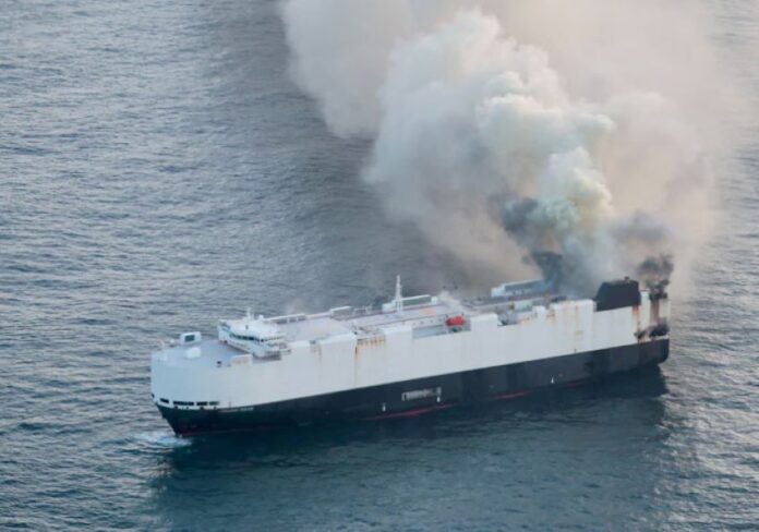 ship on fire n ocean