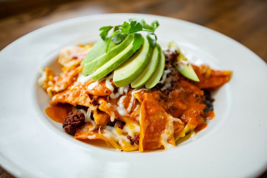 Chilaquiles rojas with avocado