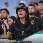 A soccer fan screams at a Mexico vs Turkey match