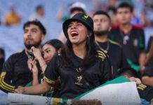 A soccer fan screams at a Mexico vs Turkey match
