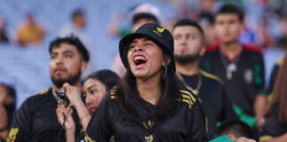 A soccer fan screams at a Mexico vs Turkey match