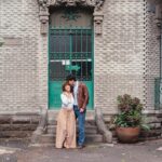 Couple stands on street corner in Mexico City