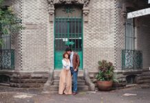 Couple stands on street corner in Mexico City
