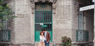 Couple stands on street corner in Mexico City