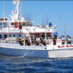 Sport fishers cast off the fishing boat Red Rooster III