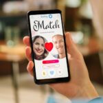 A hand holds a phone showing a dating app match screen