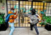 anti-gentrification protesters in Mexico City smash a window