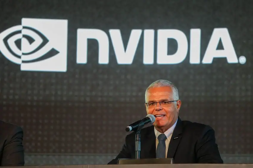 man at mike in front of Nvidia sign