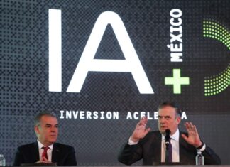 two men at podium with IA (AI in English) iage behind them.