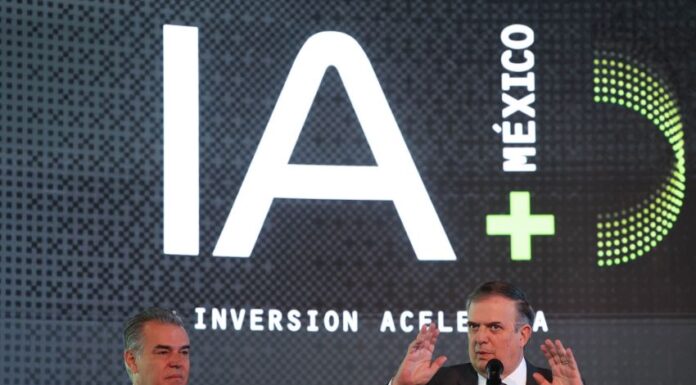 two men at podium with IA (AI in English) iage behind them.