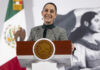 President Sheinbaum smiles from the podium of her morning press conference