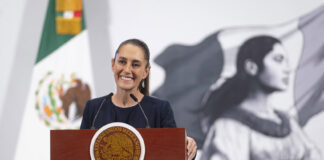 President Sheinbaum at the podium during her mañanera press conference on July 25.