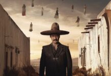 man standing in wide'brimmed hat