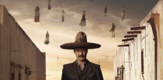 man standing in wide'brimmed hat