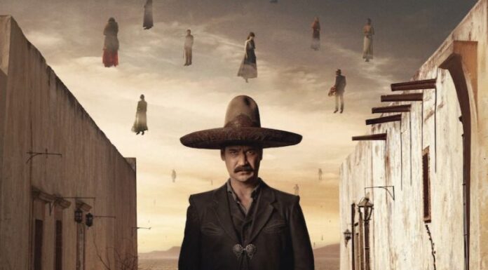 man standing in wide'brimmed hat