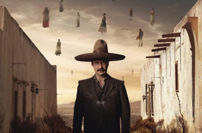 man standing in wide'brimmed hat