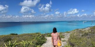 Nellie Huang walking on a cliffside path in the Riviera Maya