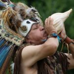 Shaman blowing conch horn