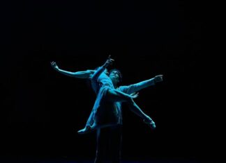 two ballet dancers in the dark