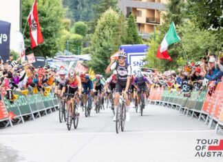 Cyclist Isaac del Toro crosses the finish line at a race in Austria