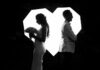 A married couple facing in opposite directions
