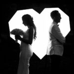 A married couple facing in opposite directions