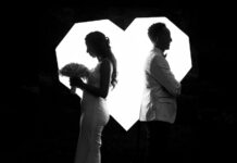 A married couple facing in opposite directions