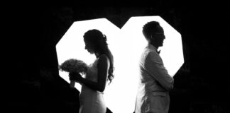 A married couple facing in opposite directions