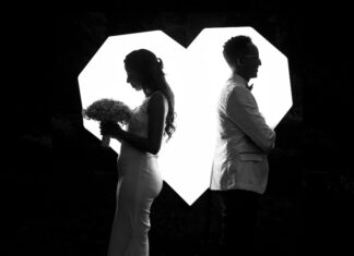 A married couple facing in opposite directions