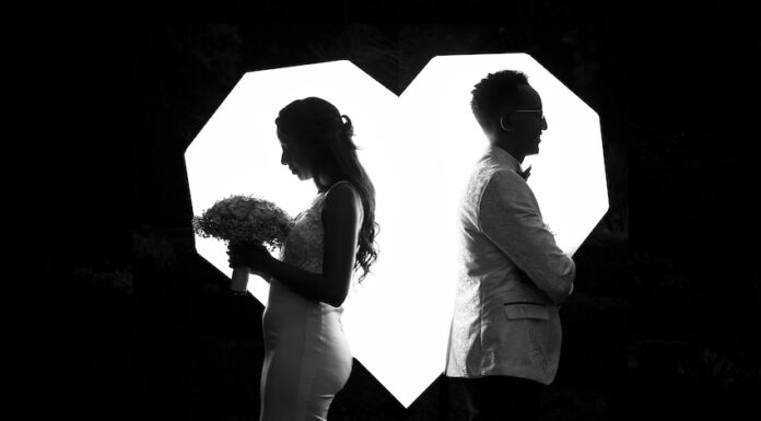 A married couple facing in opposite directions
