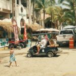 golf cart, people and buidlings of a Nayarit town