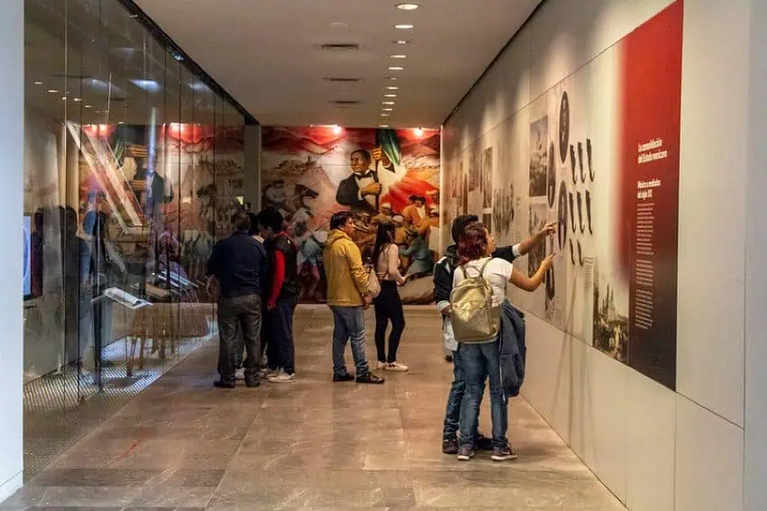 Museum visitors look at exhibits at the Museum of the Revolution