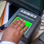 a person registering their fingerprints