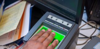 a person registering their fingerprints