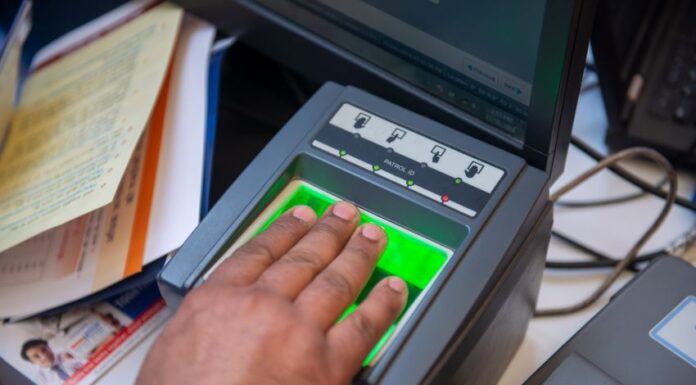 a person registering their fingerprints