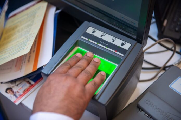 a person registering their fingerprints