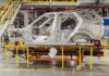 shell of a car on the assembly line