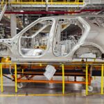 shell of a car on the assembly line