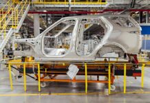 shell of a car on the assembly line