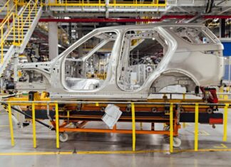 shell of a car on the assembly line