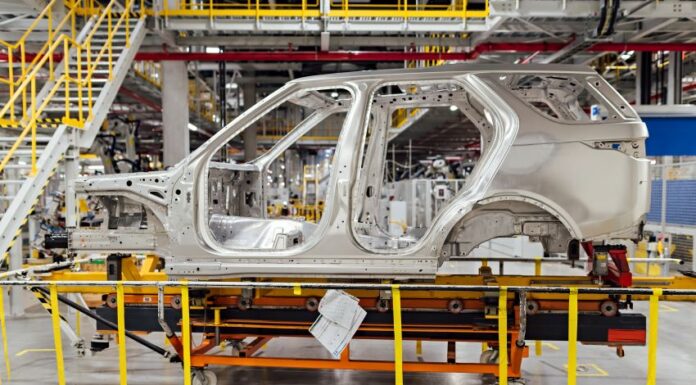 shell of a car on the assembly line