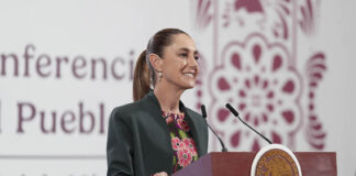 President Sheinbaum at a podium