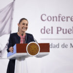 President Claudia Sheinbaum at a podium in front of the worlds "Conferencia del Pueblo"